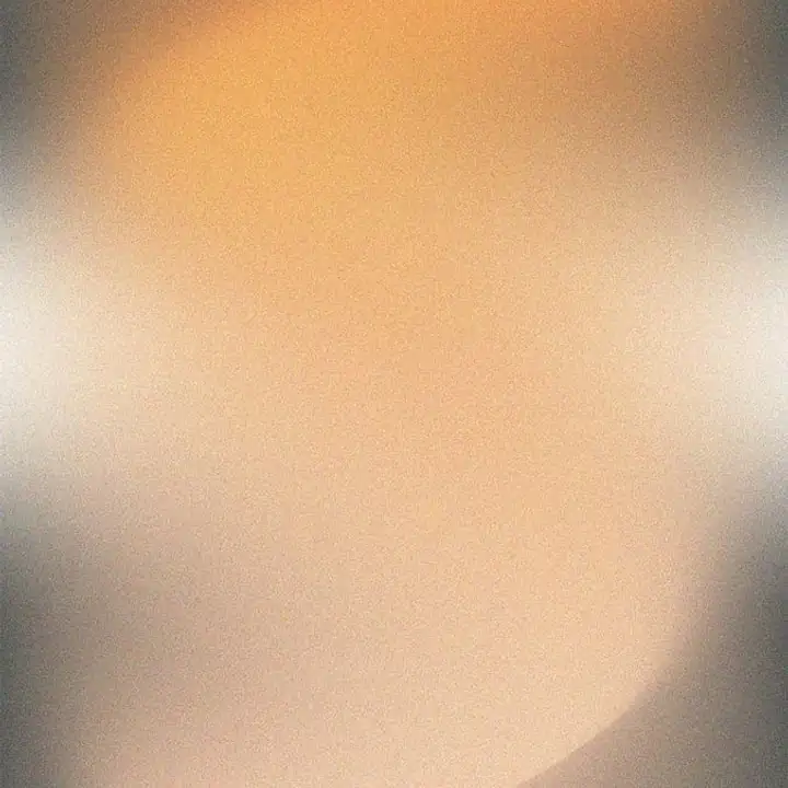 A soft amber glow blurred into warm grey