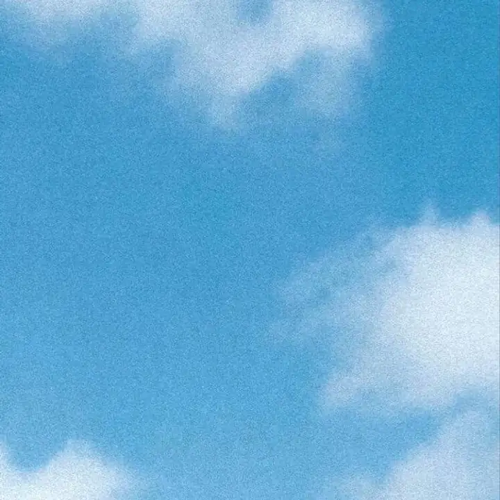 A wash of blue sky with a single soft cloud