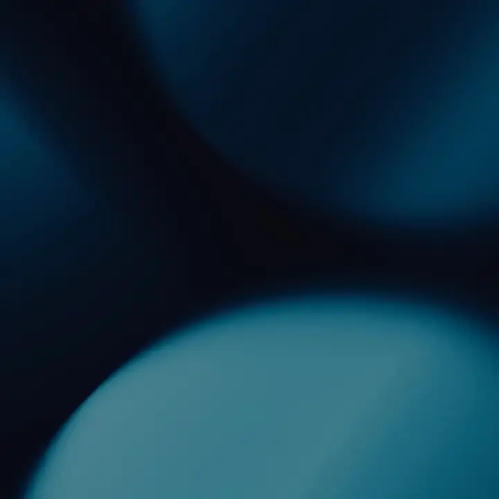 Overlapping dark teal circles in low light