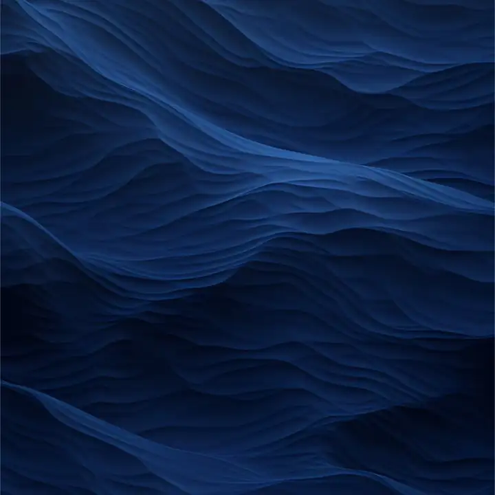 Ridges of navy sand in raking light