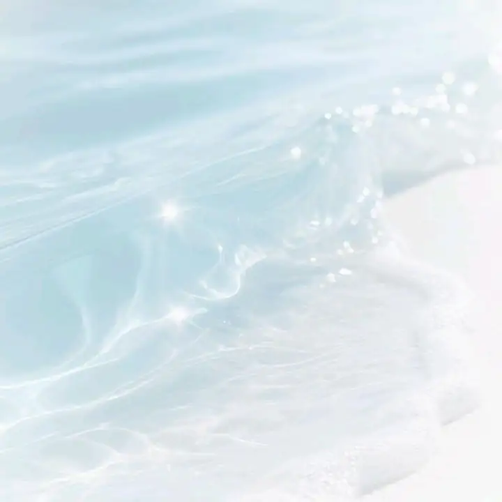 Pale blue water catching small points of light
