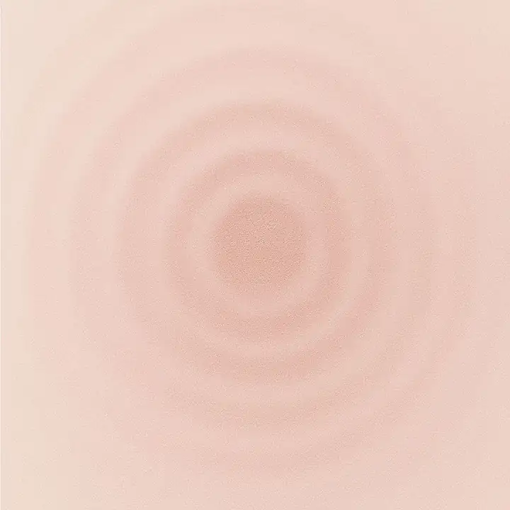 Concentric rings rippling through peach