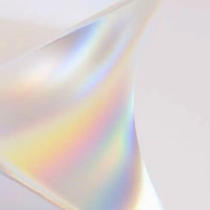 A prism of light on white, splitting into colour