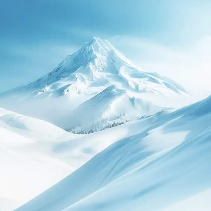 A snow peak against clear blue