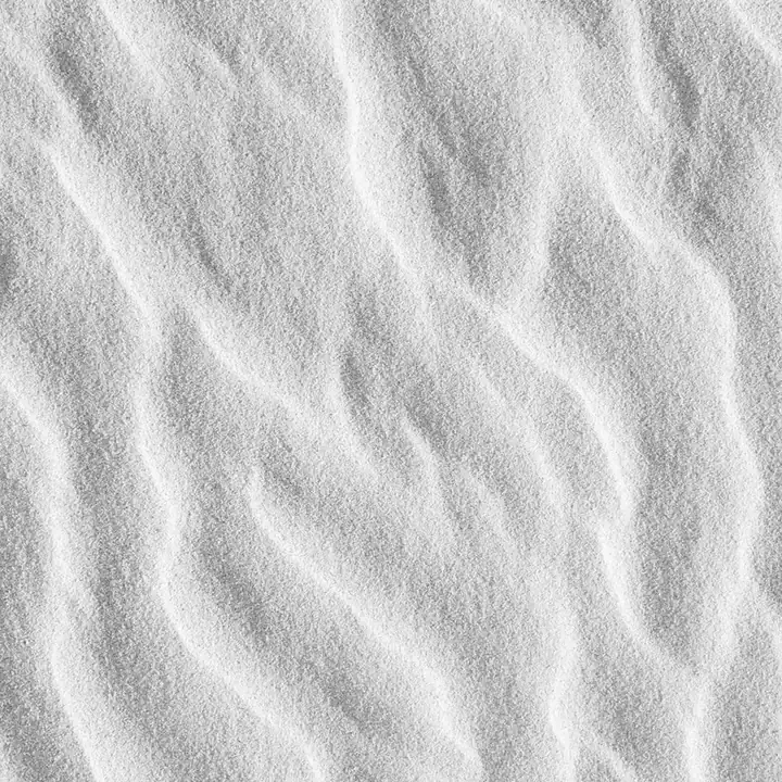 Small ripples worked into white sand